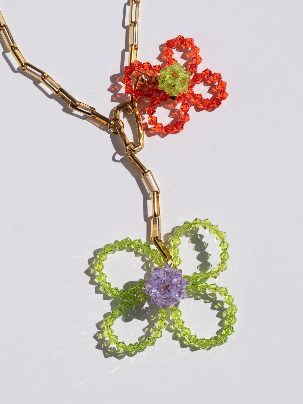 Handmade chunky necklace with colorful glass-bead flowers and a chunky gold-plated chain