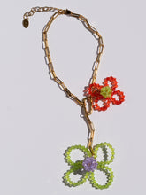 Load image into Gallery viewer, Handmade necklace with colorful glass-bead flowers and a chunky gold-plated chain.