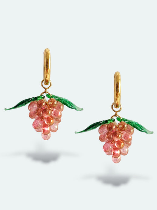 Handmade gold hoop earrings with grape charm made of pink glass drops.