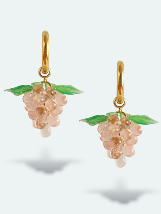 Handmade gold hoop earrings with grape charm made of pink glass drops.
