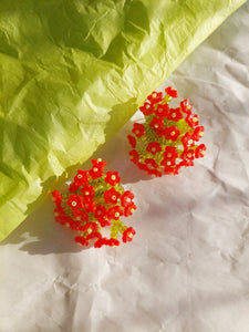 Handmade statement colourful flower beaded earrings with a retro style.