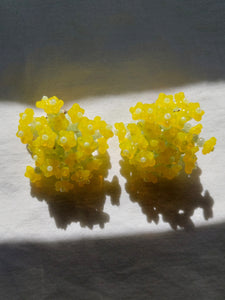 Handmade statement colourful flower beaded earrings with a retro style.