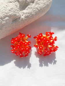 Handmade statement colourful flower beaded earrings with a retro style.
