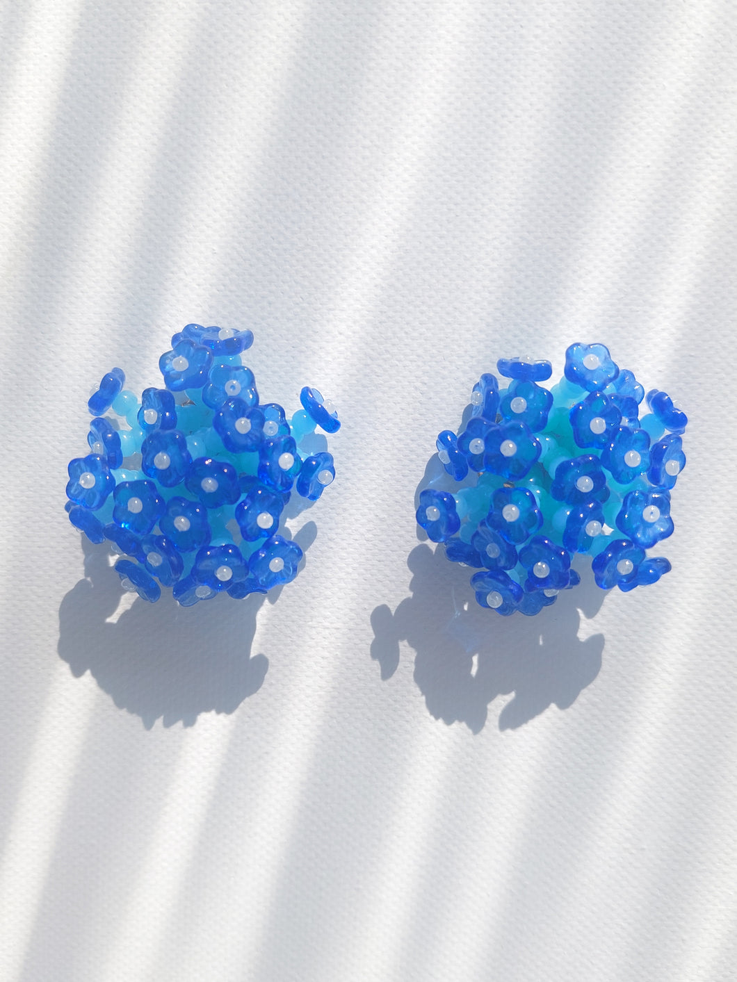Handmade statement flower beaded earrings with a retro style.