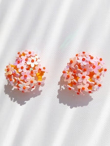 Handmade statement colourful flower beaded earrings with a retro style.